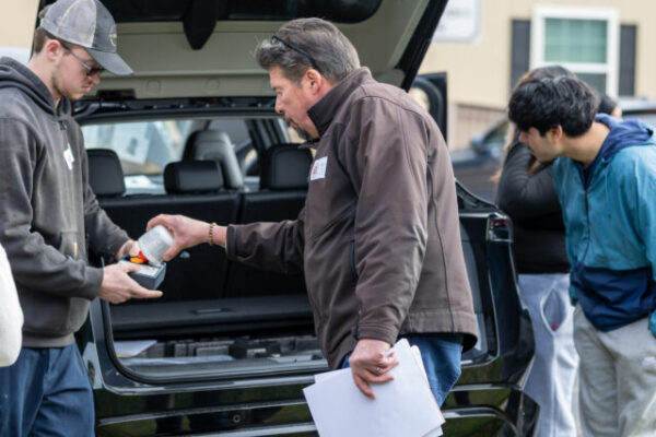 Tri-State Nissan at Level Up Day team teaching seniors about car ownership during Level Up Day at the Innovation Center
