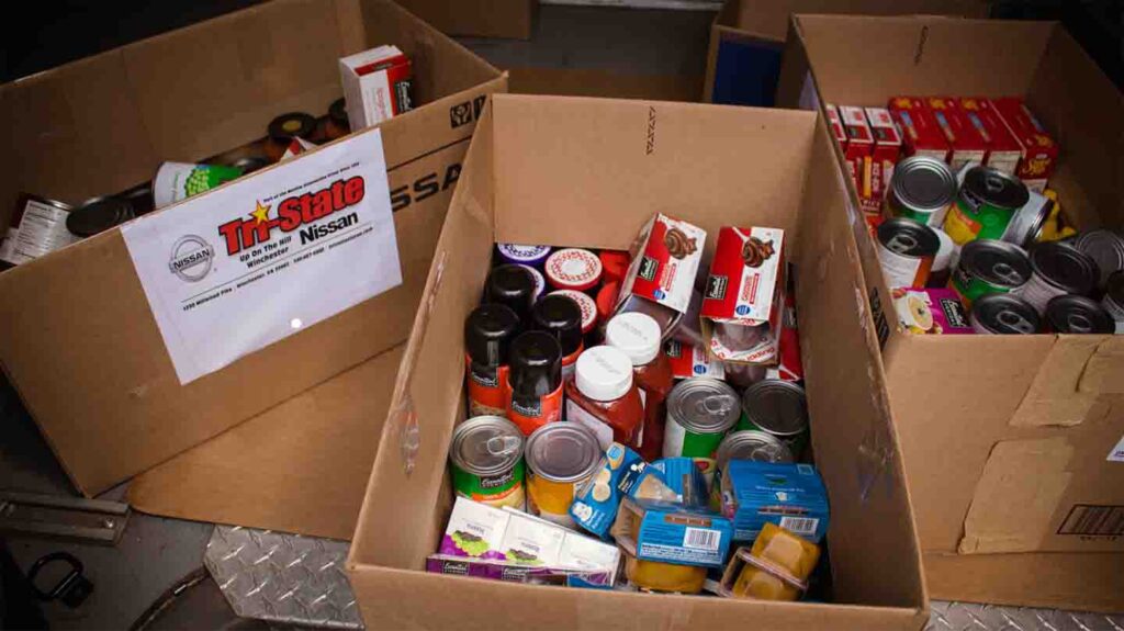 Tri-State Nissan team participating in Caliber Collision Food Drive 2018 donation collection