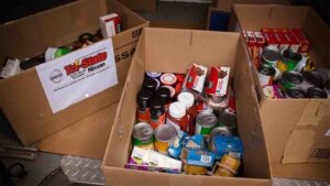 Tri-State Nissan team participating in Caliber Collision Food Drive 2018 donation collection