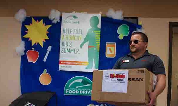 Tri-State Nissan team participating in Caliber Collision Food Drive 2018 donation collection
